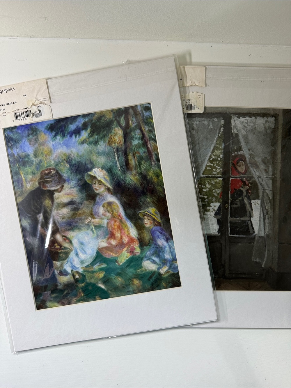 Two matted impressionist prints by Renoir and Monet.